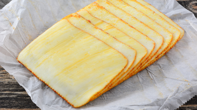 sliced cheese in deli paper