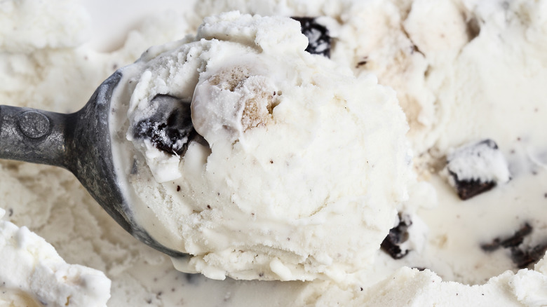 scooping chocolate cookie dough ice cream