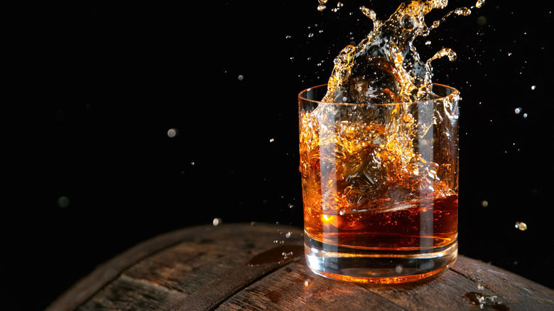 Bourbon splashing around in glass