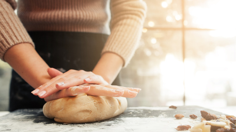 woman kneading cookie dough