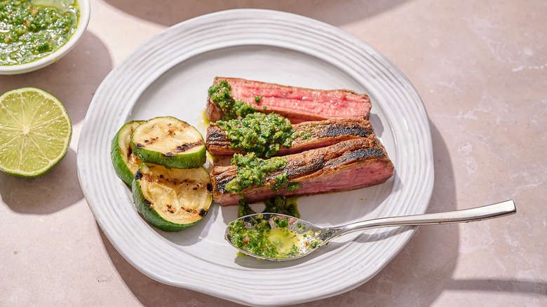 slices of flank steak on a plate