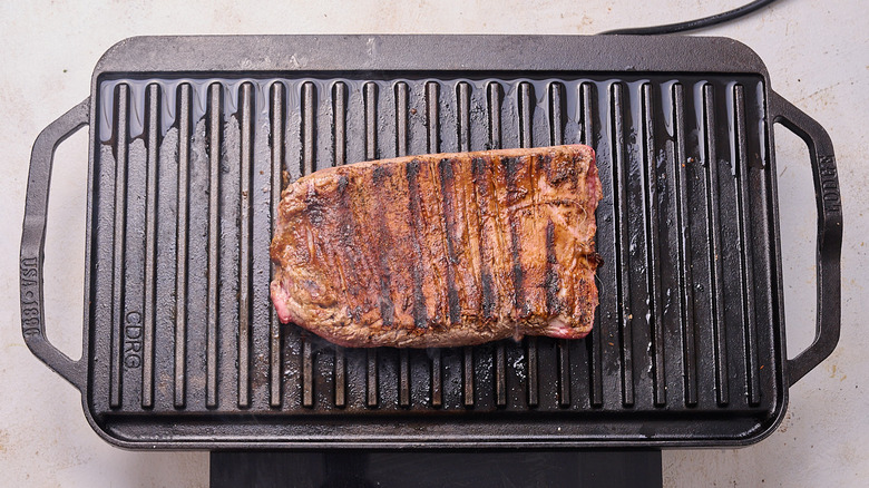 searing steak on a grill pan
