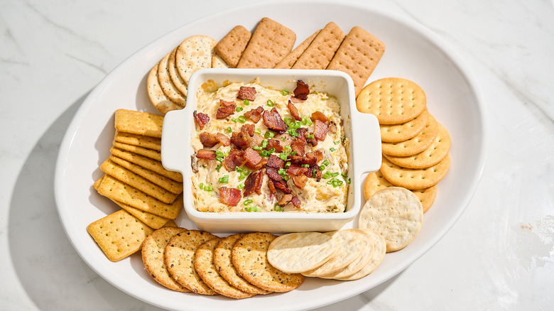 chicken bacon ranch dip on a platter with crackers