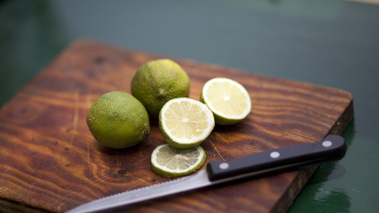 Limes on a cutting board