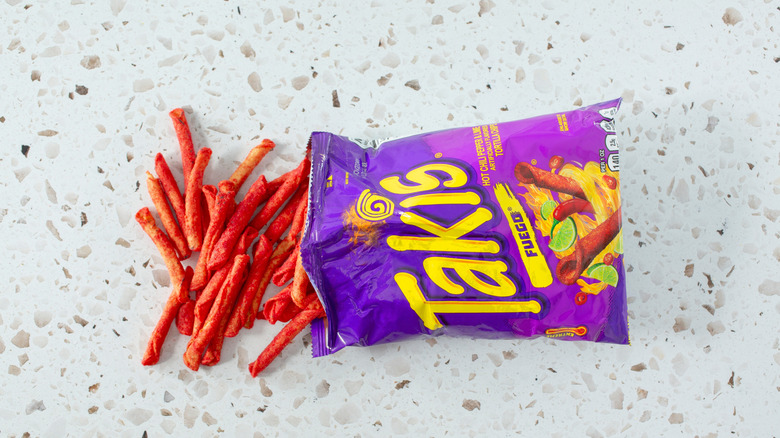 A top down view of a pile of Takis