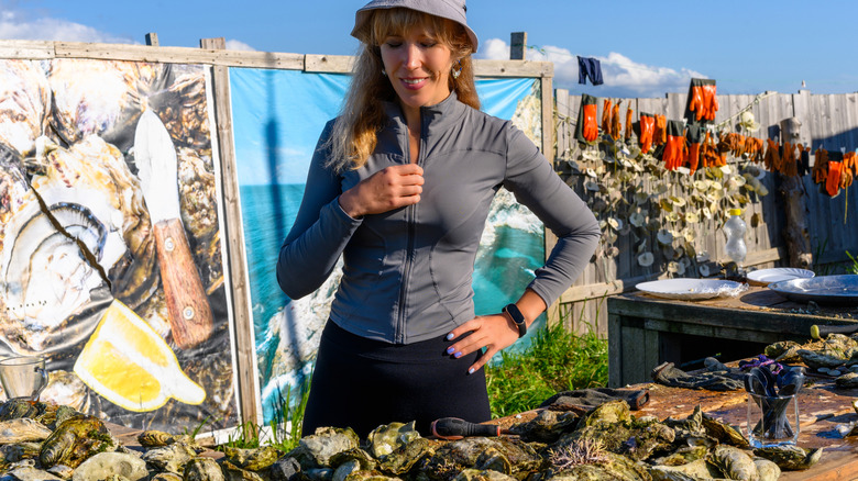 woman inspecting oysters