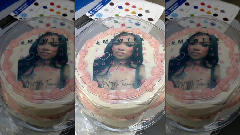 Sam's Club photo cake with woman's image and Sam's cake book in background