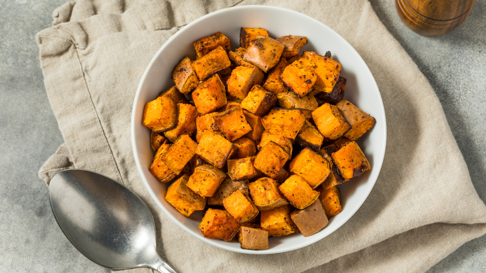 The Unassuming Pantry Staple To Add To Roasted Sweet Potatoes For Extra-Crispy Results - Tasting Table