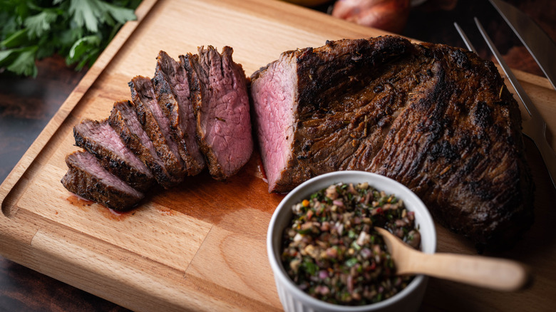 Sliced tri-tip steak on a cutting board