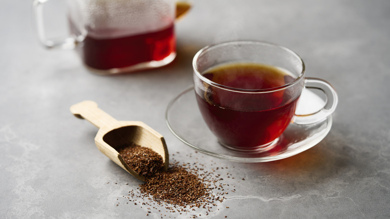 Dried rooibos and a cup of rooibos tea