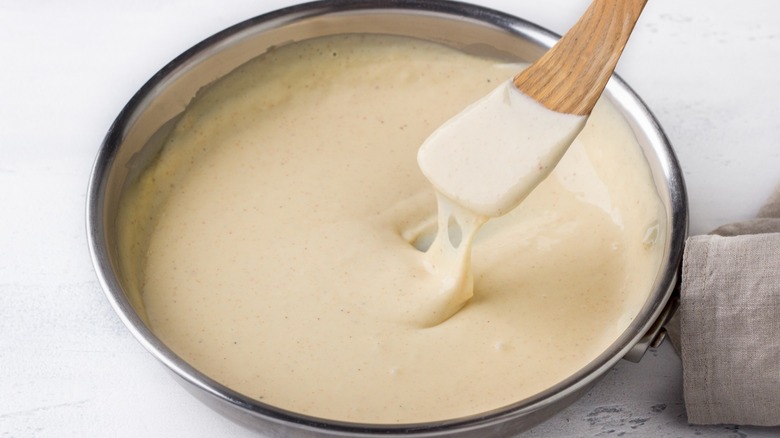 A creamy French béchamel sauce in a pan