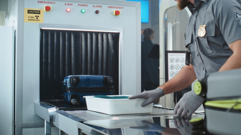 airport security check point with conveyer belt