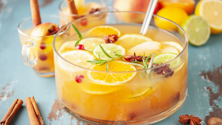 hot spiked apple cider punch in bowl and glasses