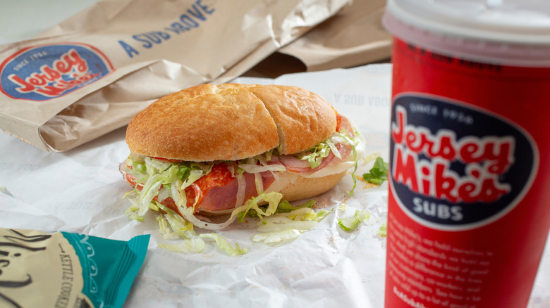 jersey mike's sub sandwich, drink and bag of chips