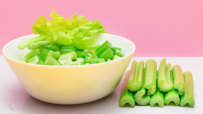 Fresh celery sliced in bowl