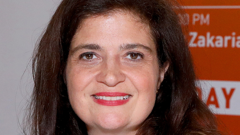 Alex Guarnaschelli smiles on a cooking show