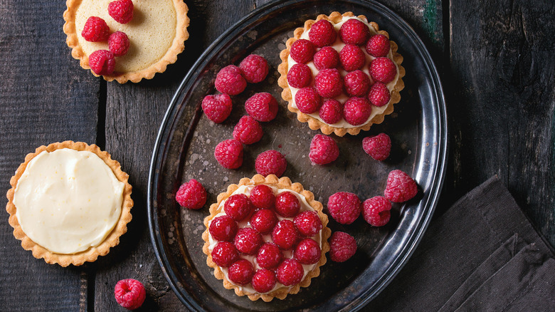 Raspberry tarts waiting to be brushed with glaze