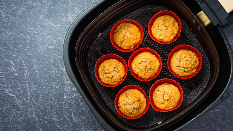 Baked cupcakes inside of an air fryer basket