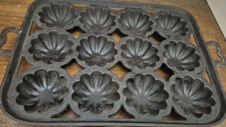 Fluted cast iron gem pan on wood table