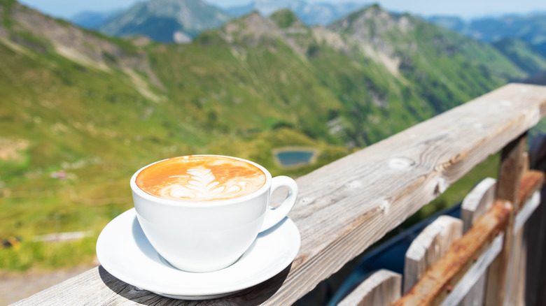 cup of coffee with scenic background