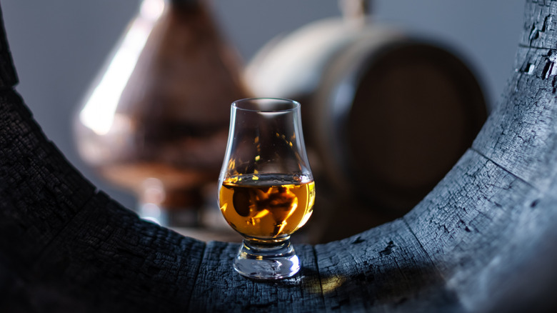 Bourbon displayed in oak barrel