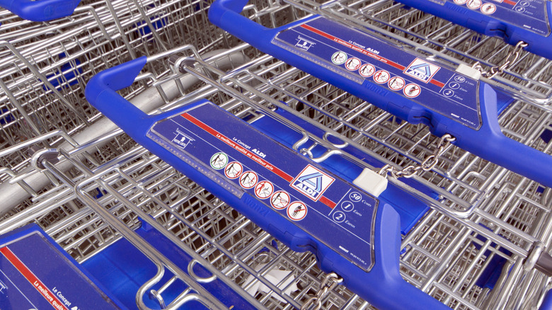 Close-up of Aldi shopping carts with quarter slots
