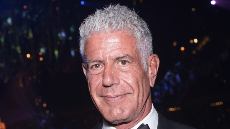 Anthony Bourdain holding Primetime Emmy
