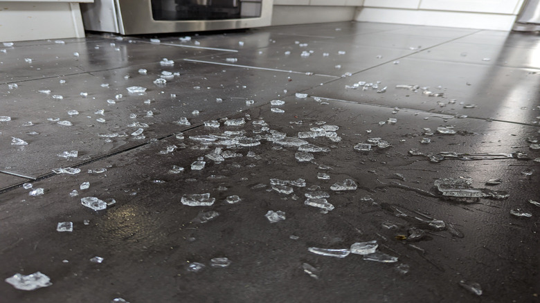 Home kitchen floor littered with broken glass