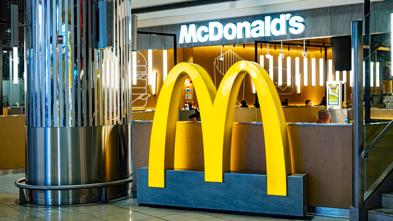 McDonalds location within airport featuring iconic golden arches