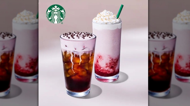 A coffee drink with pink cream and chocolate shavings on top and a second drink that is mostly pink with a red swirl at the bottom and whipped cream on top