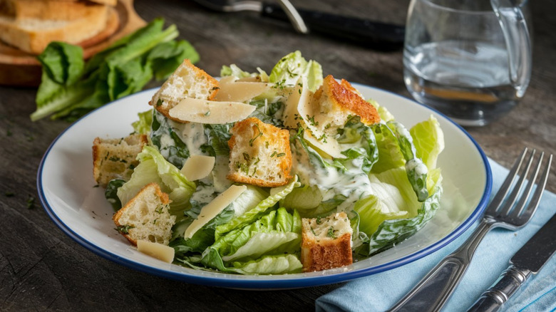 Caesar salad on white plate