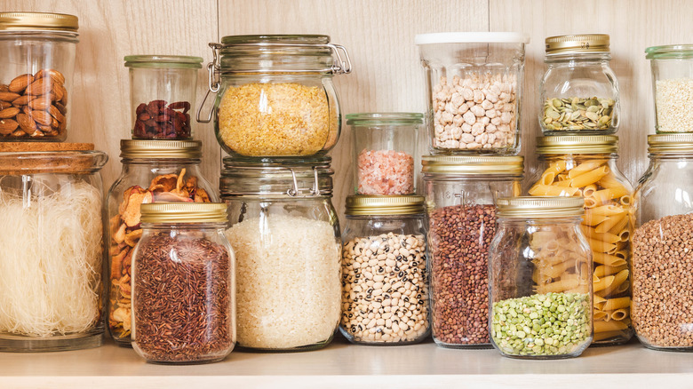 various grains in jars in a pantry