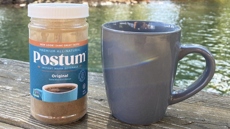 Postum package next to mug