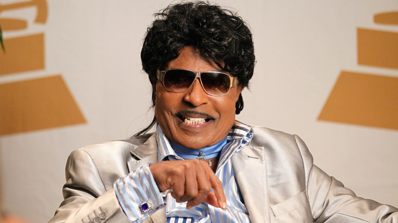 Little Richard smiling with sunglasses in silk blazer