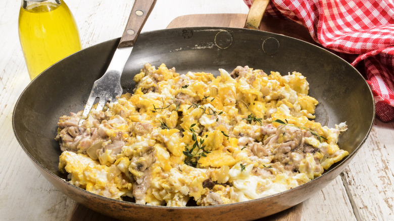 Scrambled brain and eggs in skillet