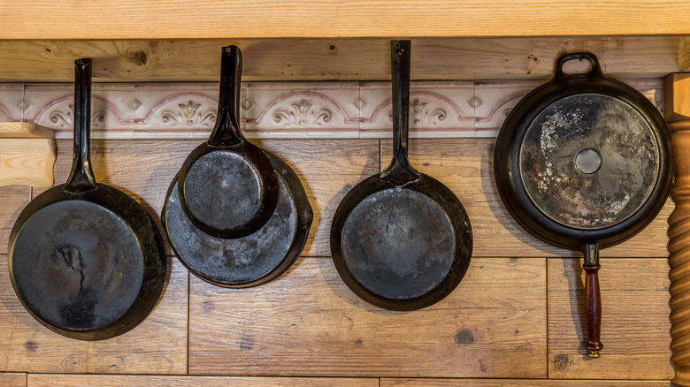 old cast iron pans hanging