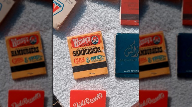 Wendy's vintage matchbook cover next to other various matchboxes.