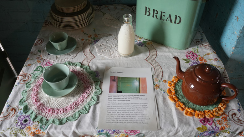 Vintage doilies, tea set, tablecloth on table