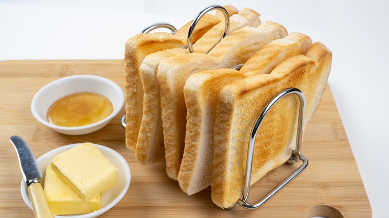 Toast in rack with butter and honey