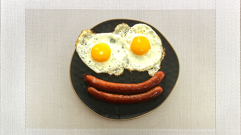 Sunnyside up eggs and breakfast sausage smile