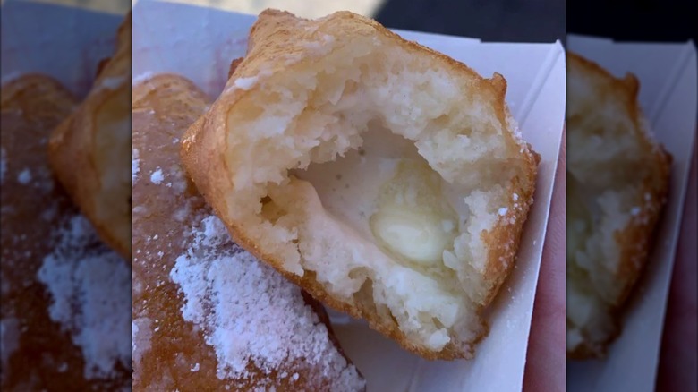 Pieces of deep-fried butter on paper tray.