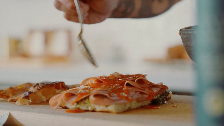 Chef Eric Fralick of Kinjo preparing his pistachio and yuzu kosho Panino