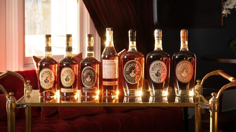 a line of Michter's bottles on a metal cart