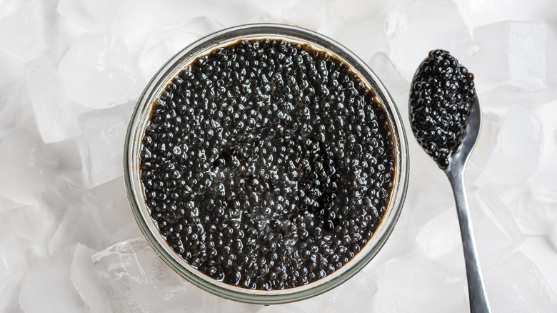 A tin of black caviar on ice