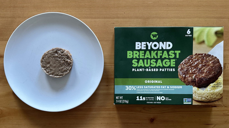 Beyond breakfast sausage on a white plate next to the box