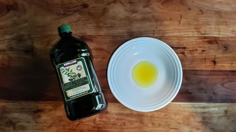 Italian olive oil from Kirkland on a table with a plate