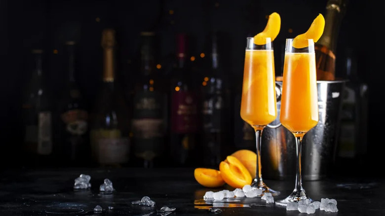 Bellinis with a peach garnish