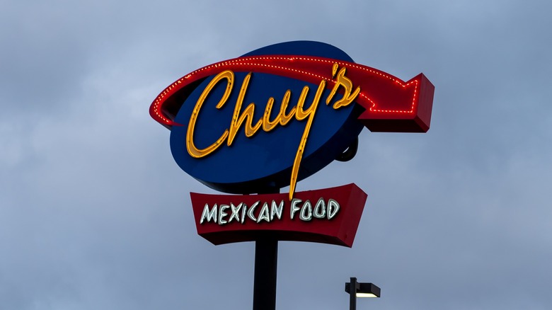 Chuy's sign with view of sky