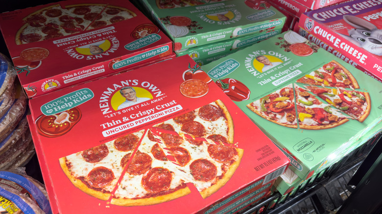 different Newman's Own frozen pizzas in the freezerr