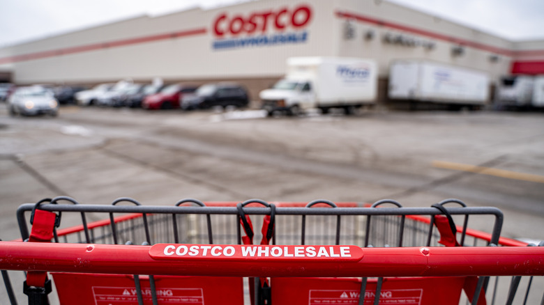 costco shopper entering store with cart